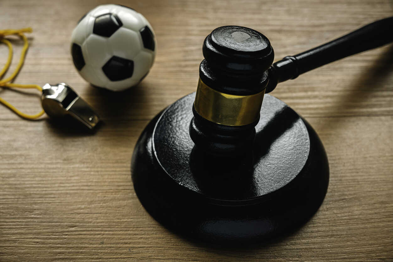 Gavel, whistle, and soccer ball, symbolizing sports industry employment lawyer in california.